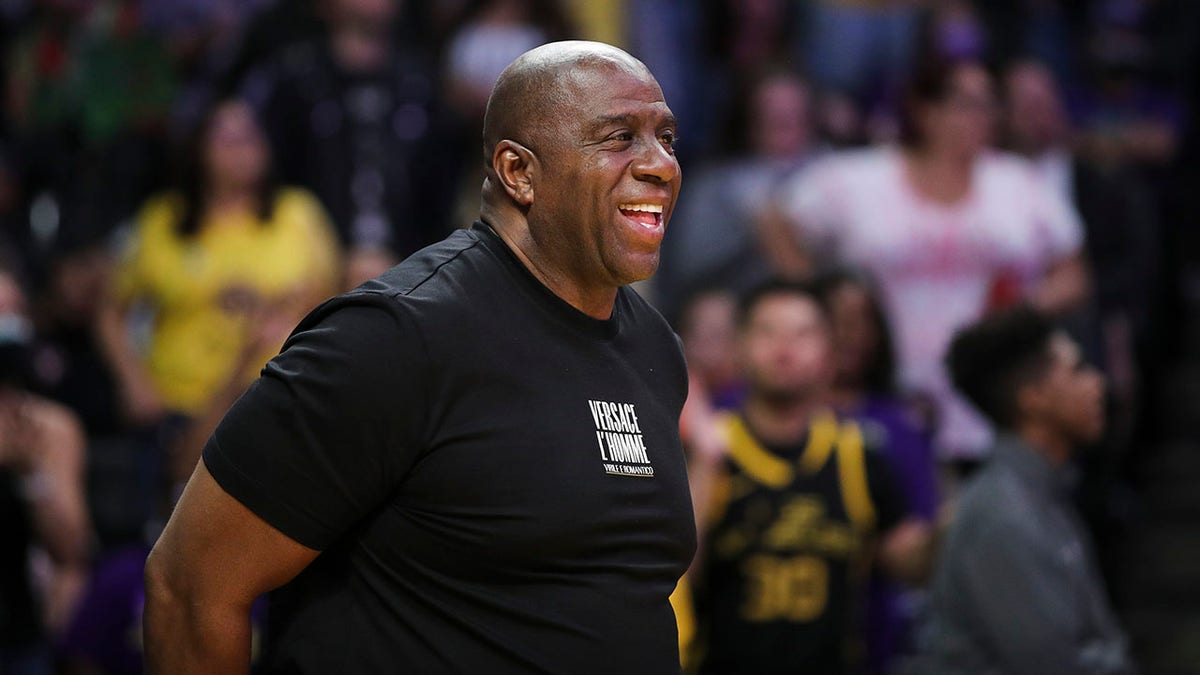 Magic Johnson looks on