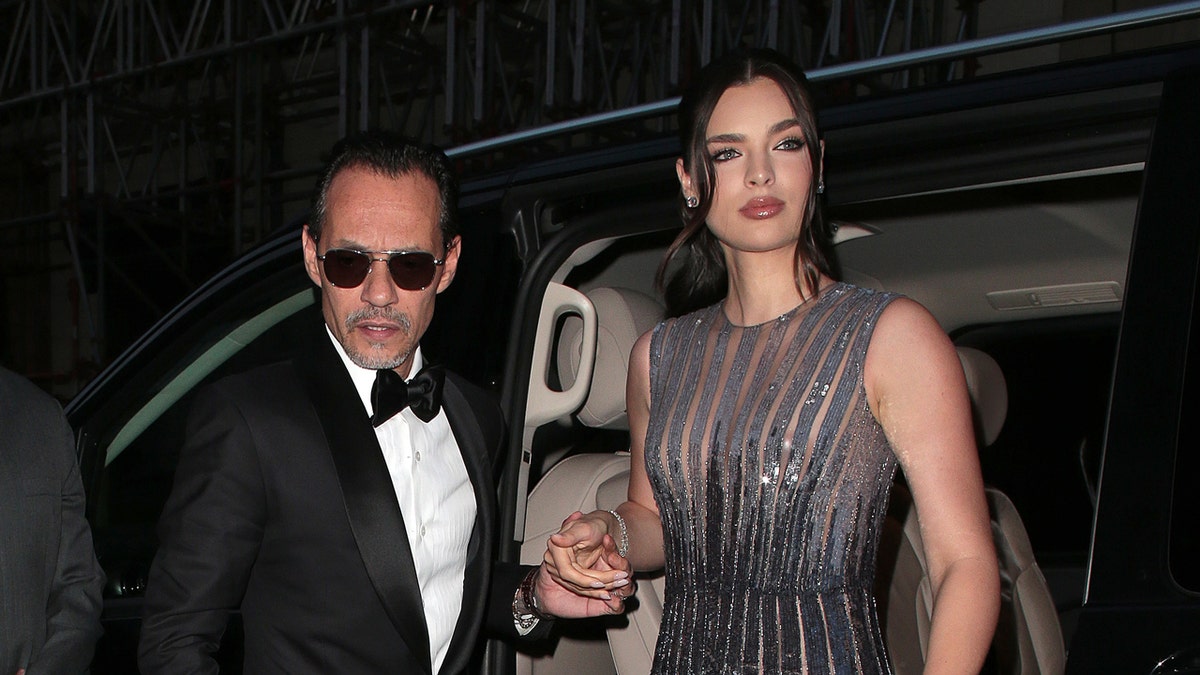 Marc Anthony and Nadia arrive at an event