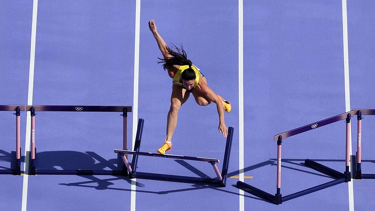 Michelle Jenneke knocks over a hurdle