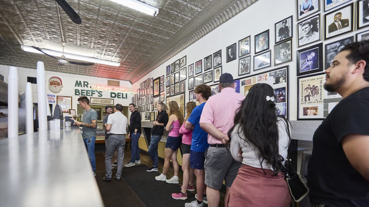 Patrons wait in line inside Chicago's Mr. Beef.