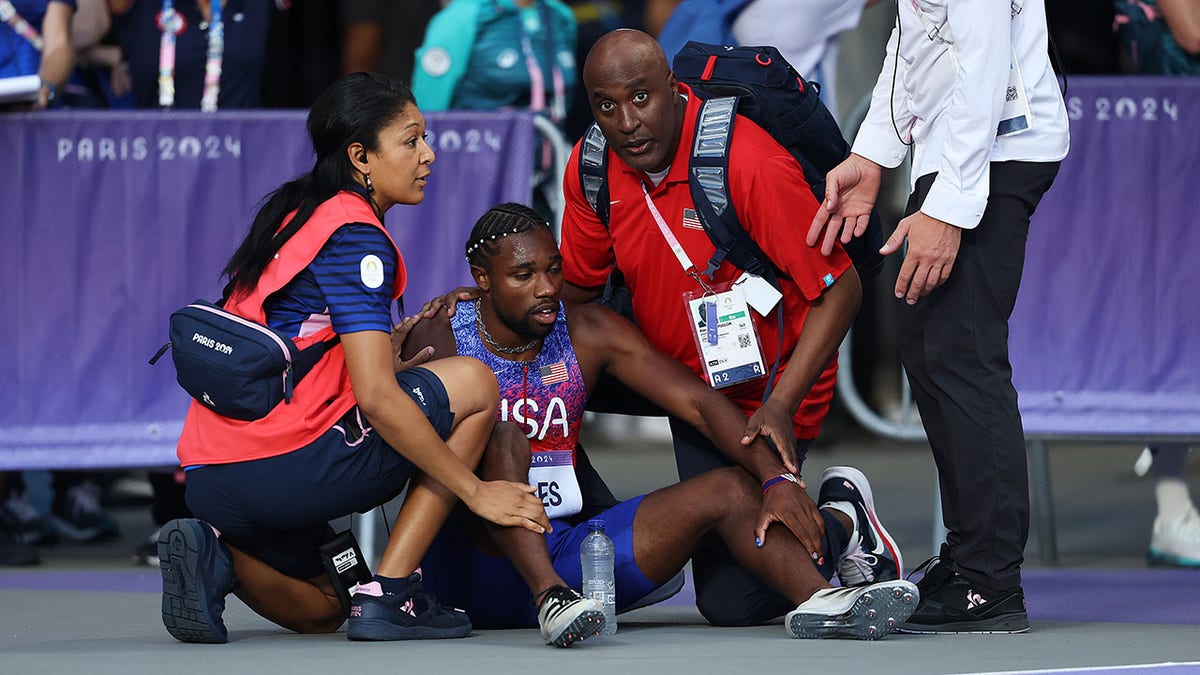 Noah Lyles getting medical treatment