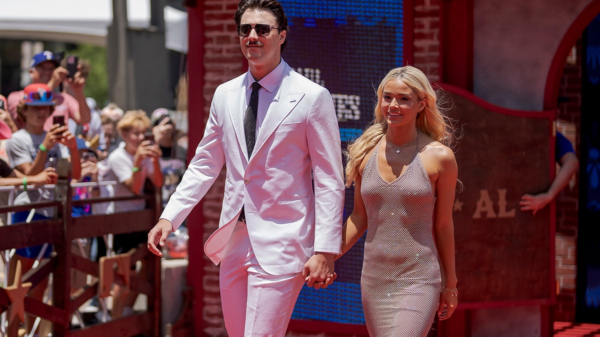 Paul Skenes and Olivia Dunne walk on red carpet