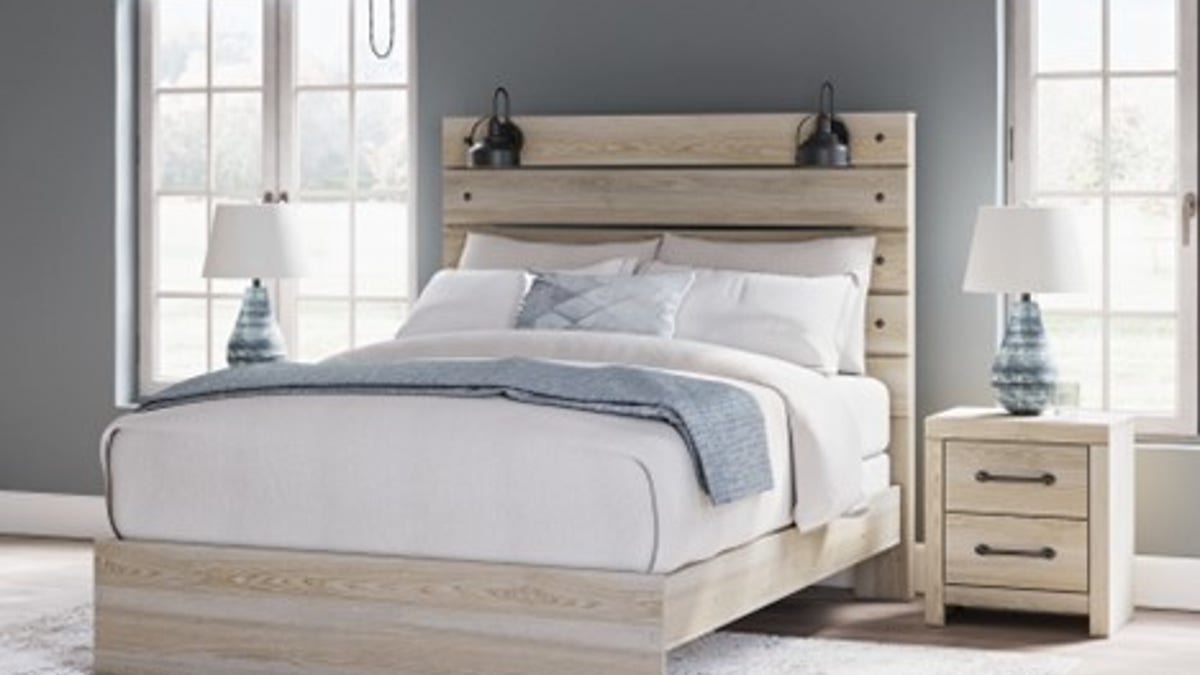 A rustic bed frame with built-in lamps is the ideal addition to any bedroom.