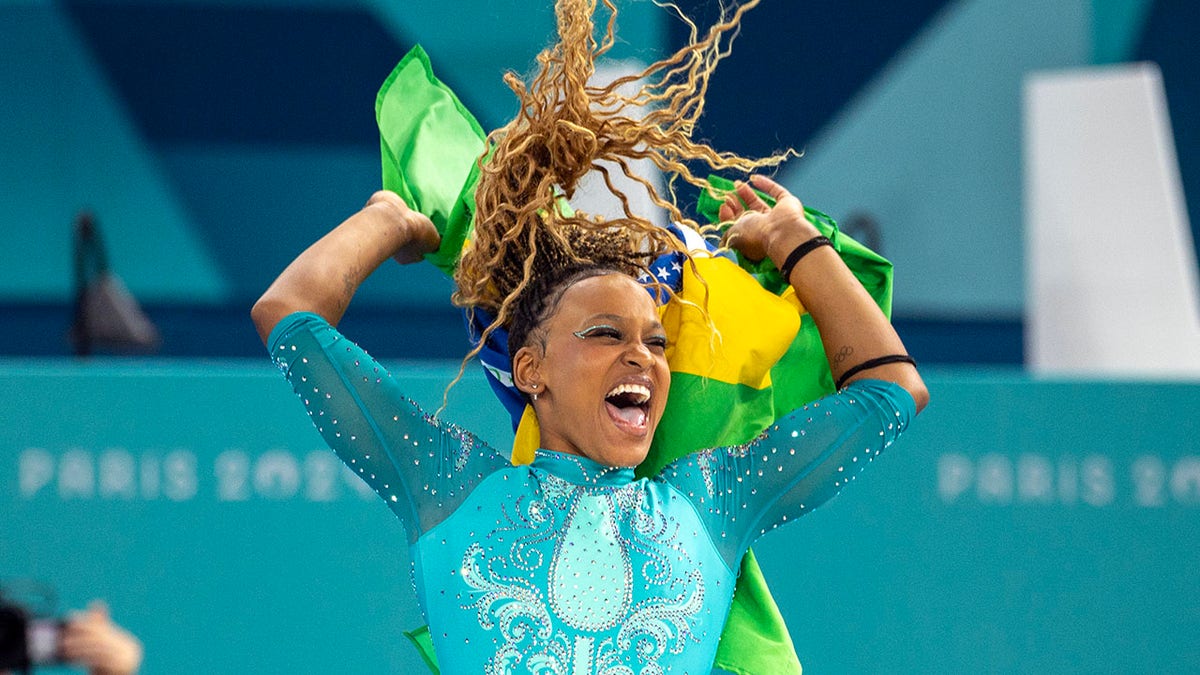 Rebeca Andrade celebrates the gold