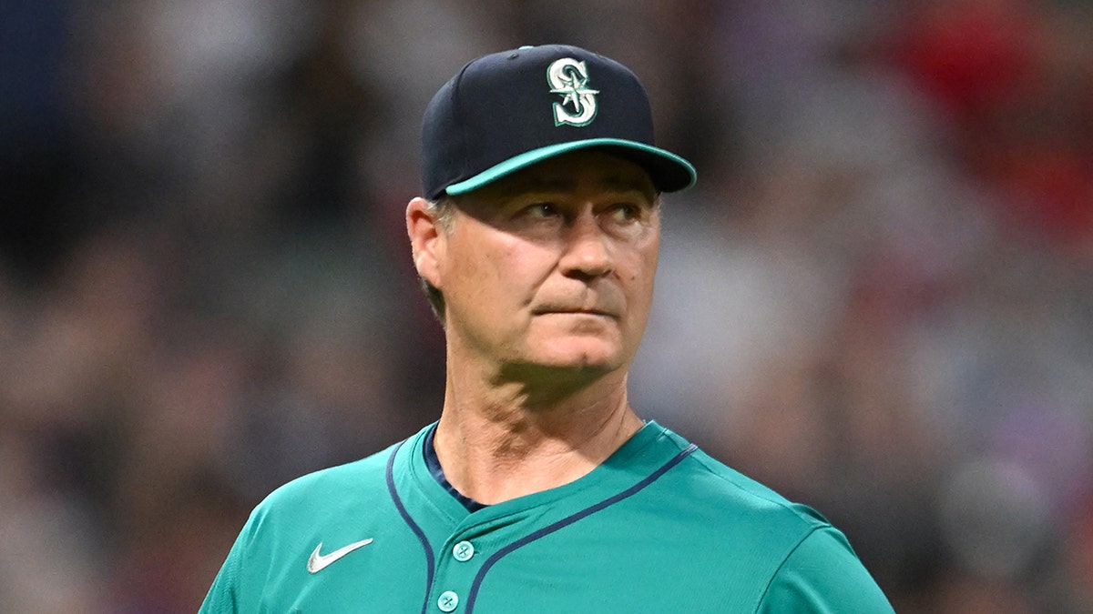 Scott Servais looks on field