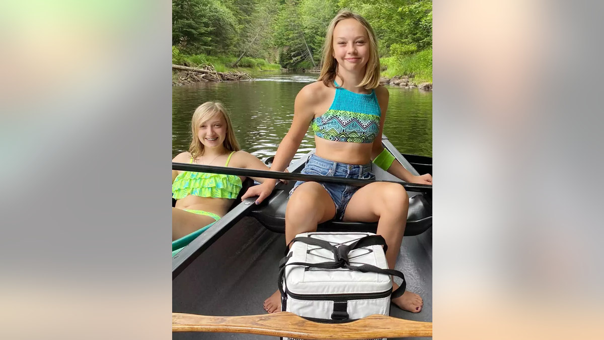 Shelby and Hailey Trumble in a boat.