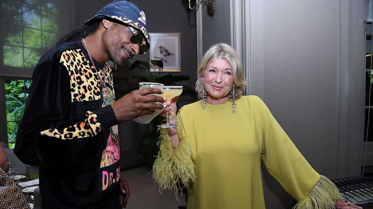 Snoop Dogg and Martha Stewart clinking glasses