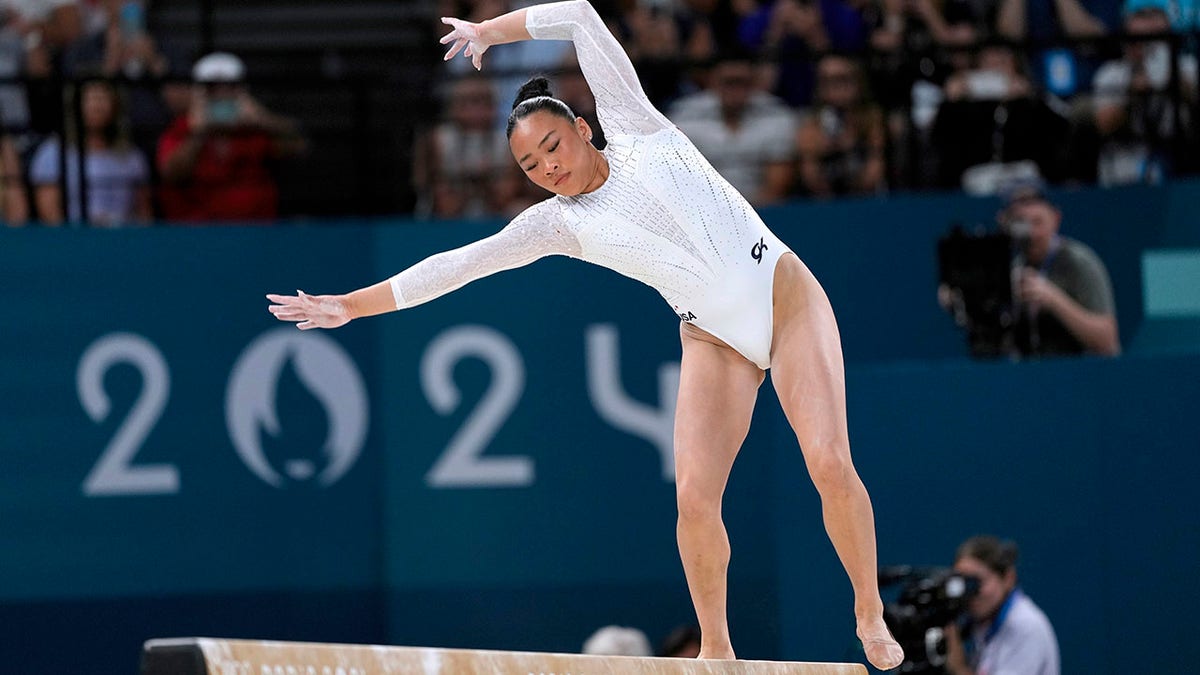 Suni Lee focuses on her balance