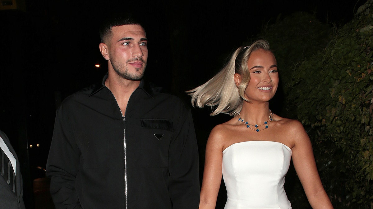 Tommy Fury and Molly-Mae Hague walk