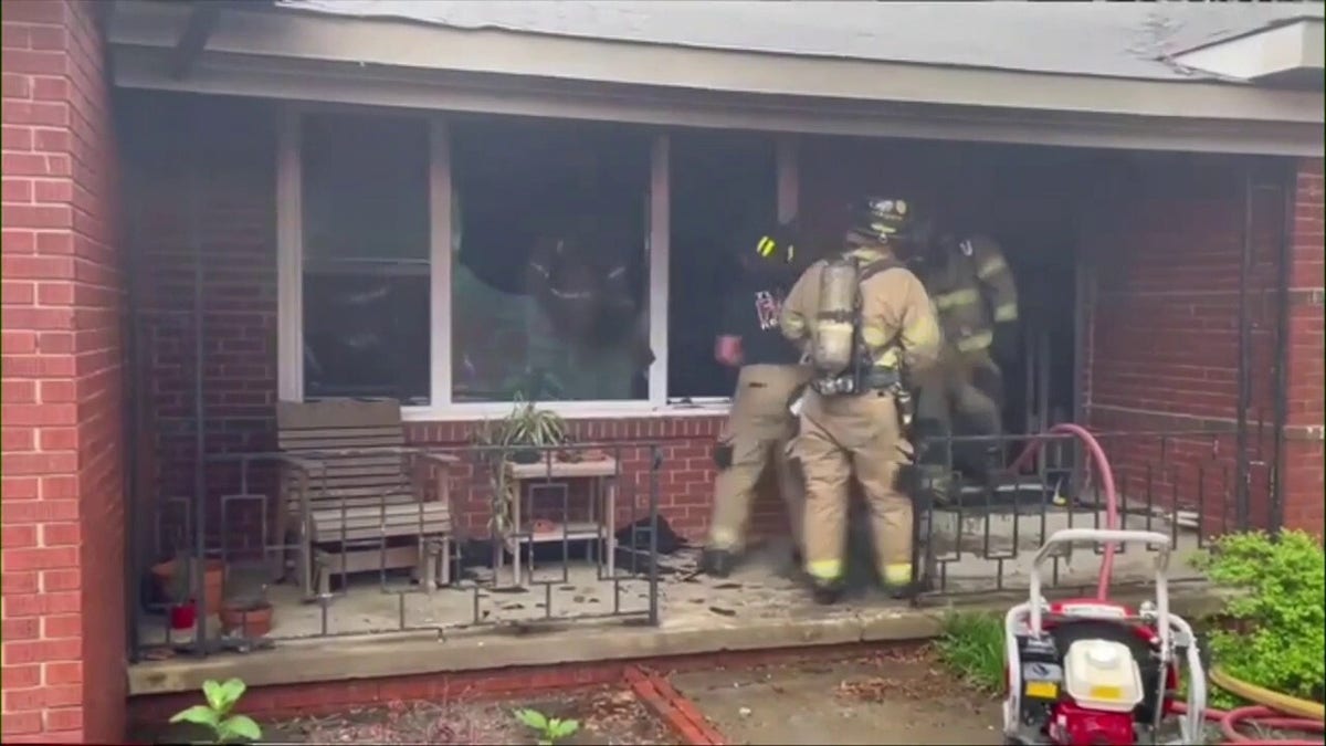 Firefighters put out a house fire