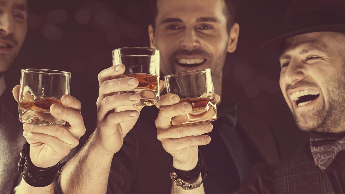 Three men drinking whiskey