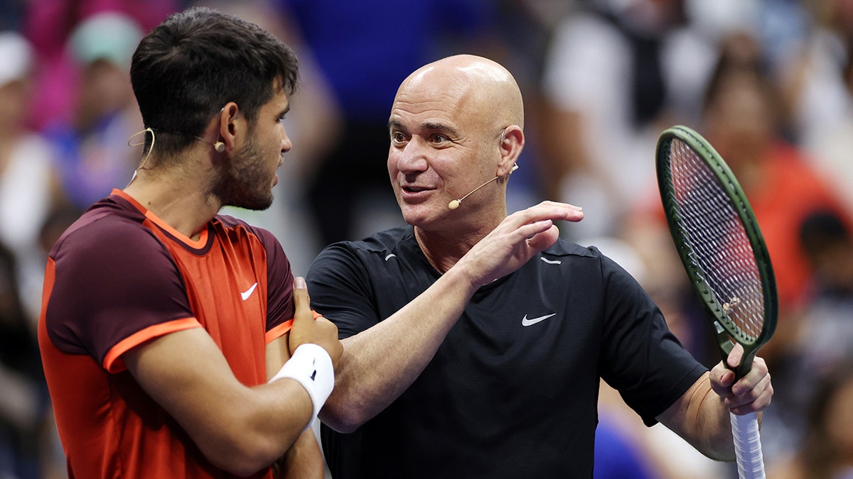 Andre Agassi talks to Carlos Alcaraz