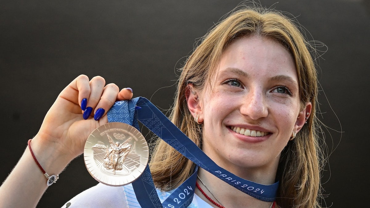 Romanian gymnast Ana María Barbosu poses with her Olympic bronze.