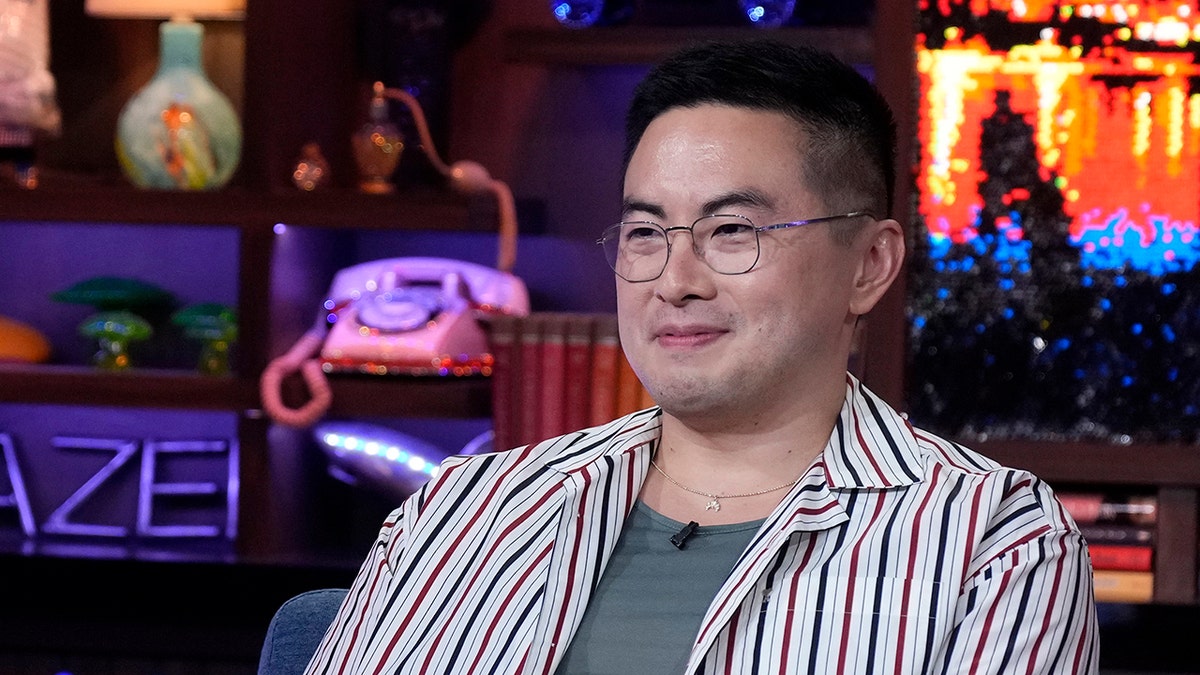 Comedian Bowen Yang wears striped shirt on talk show.