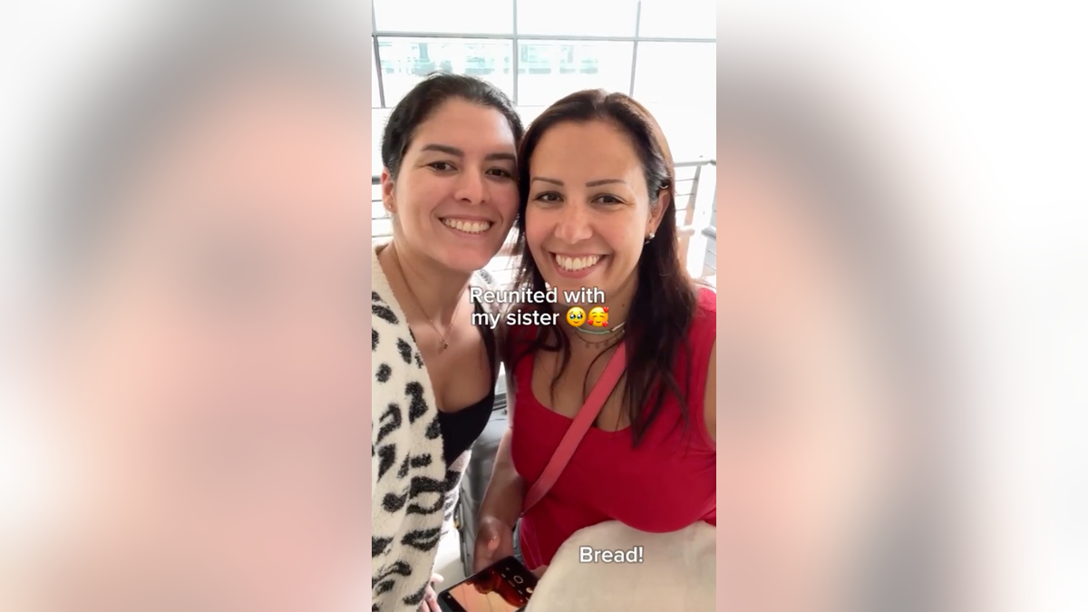 Sisters smile with bread