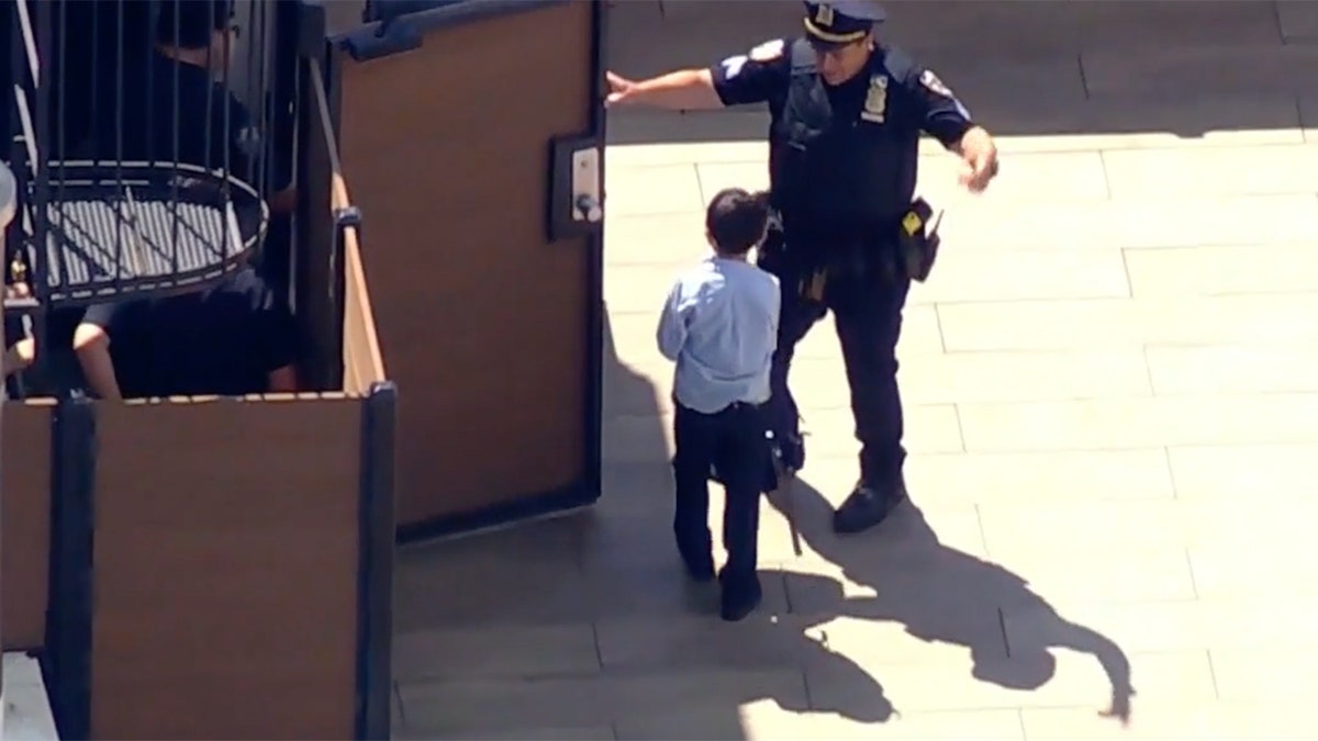 NYPD officers with schoolboys