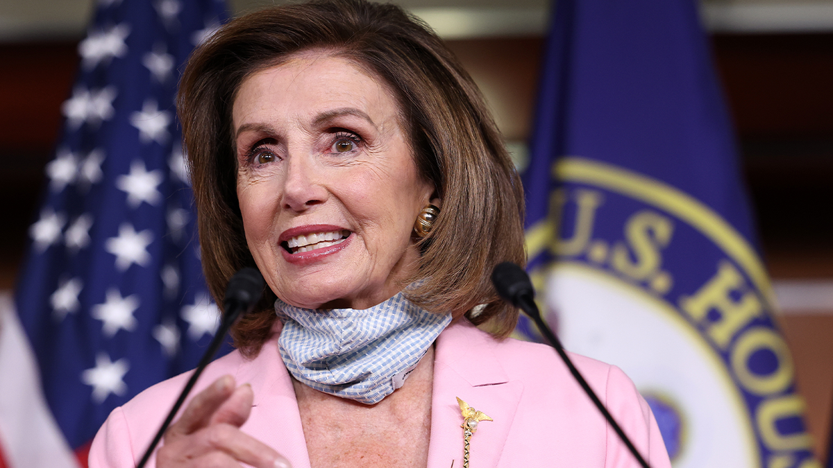 Pelosi speaking at the podium