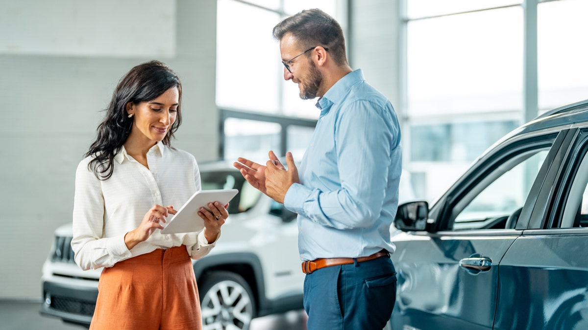 A woman car shopping