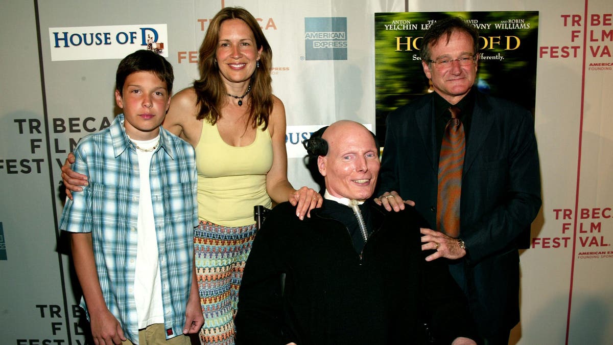 A photo of Christopher Reeve with his wife, son and Robin Williams