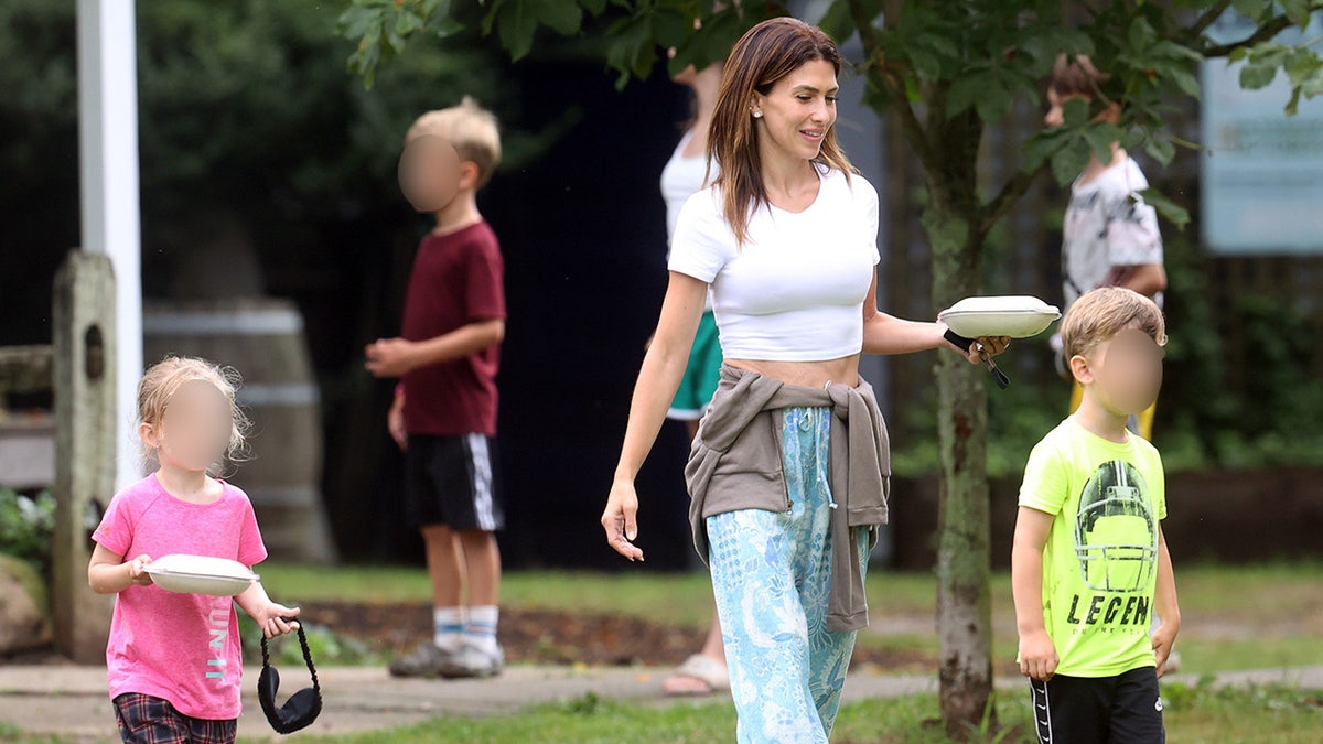 Alec Baldwin's wife walks with her kids while filming reality show.