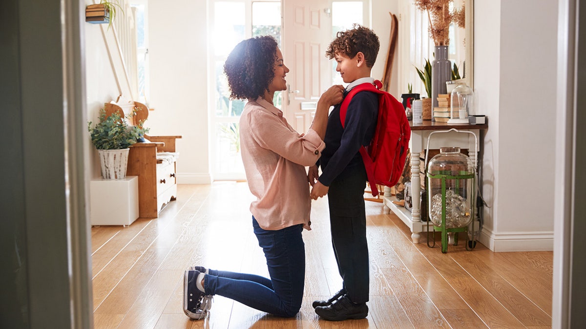 Mom and young son with backpack