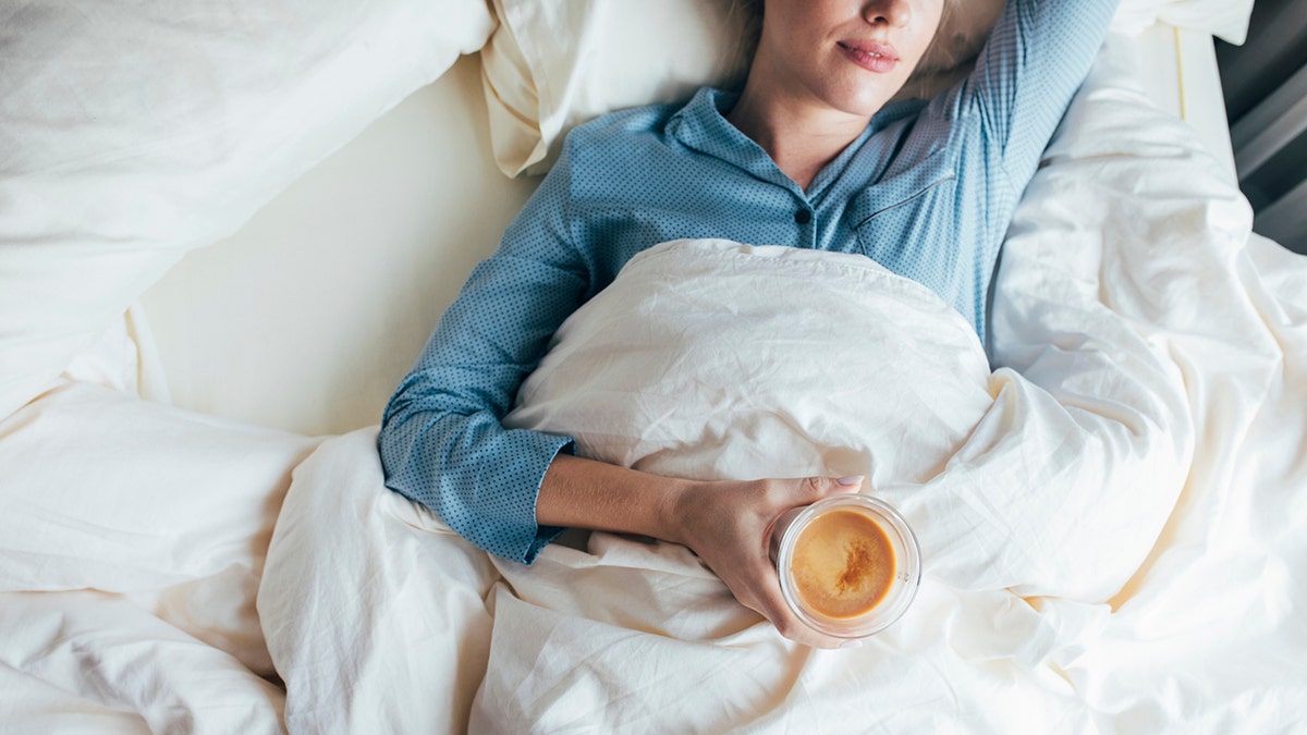 woman lying successful  furniture  holding java  successful  hand.