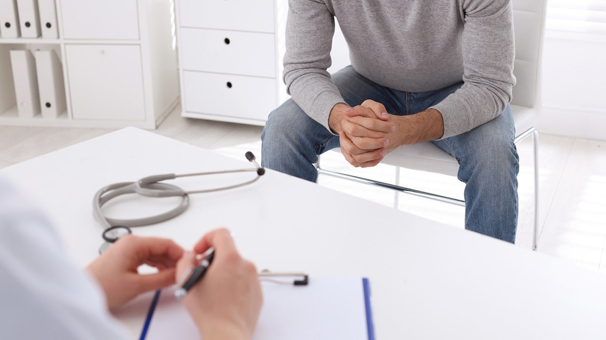 Man having appointment with specialist in clinic