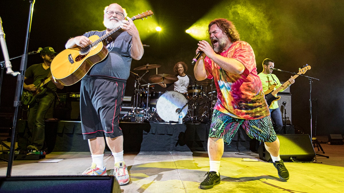 Jack Black on stage with his bandmate with Tenacious D.