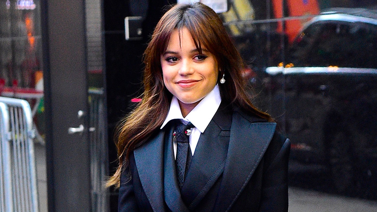 Jenna Ortega in black outside of "Good Morning America"