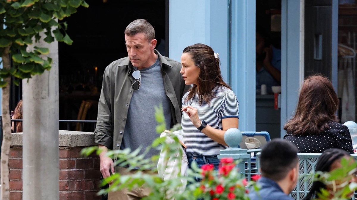 Ben Affleck sports a green jacket while talking with ex Jennifer Garner.