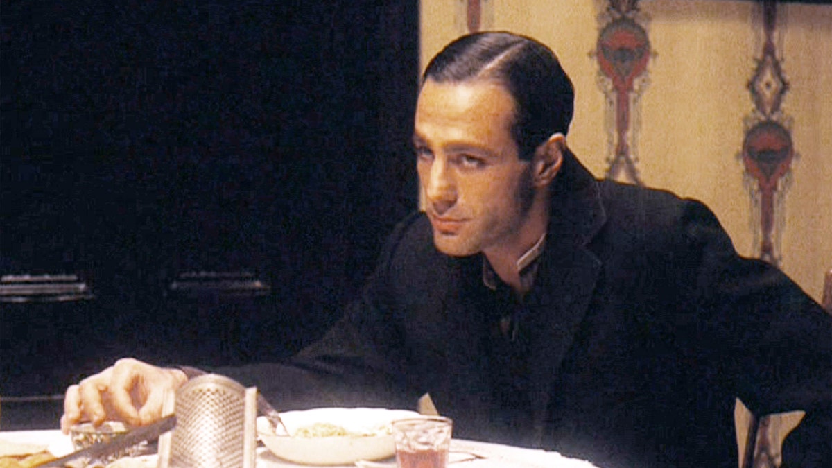 Actor John Aprea sports black coat in Godfather scene