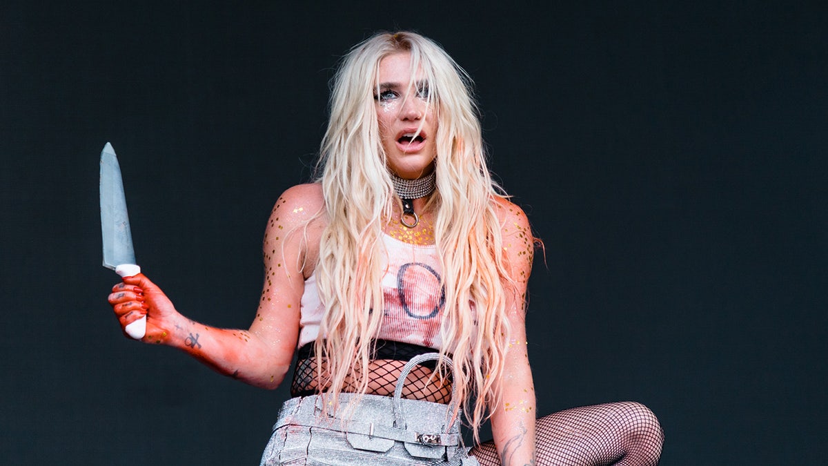 Kesha performing at Lollapalooza with a knife.