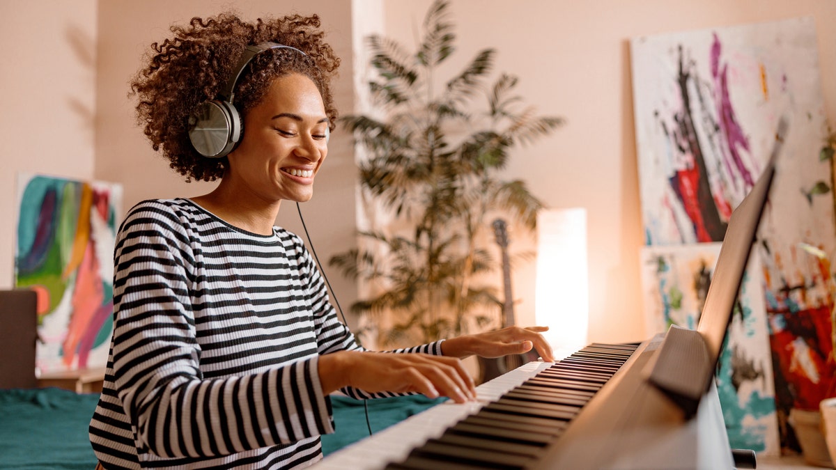 A woman playing the keyboard