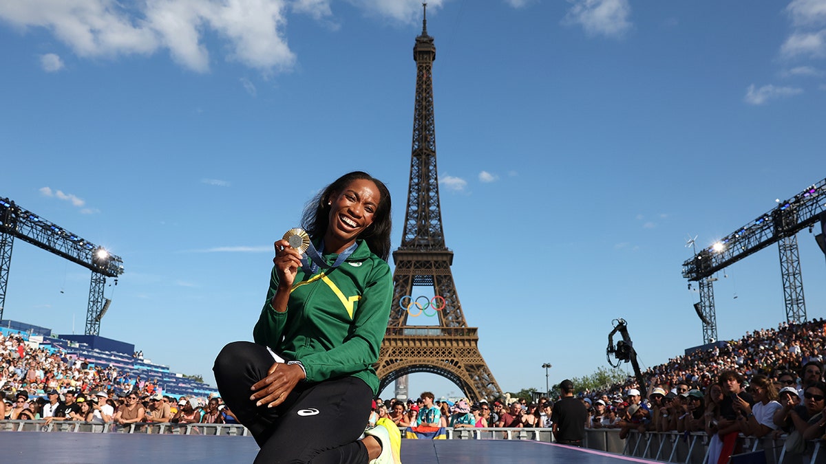 Thea LaFondn in front of the Eiffel Tower