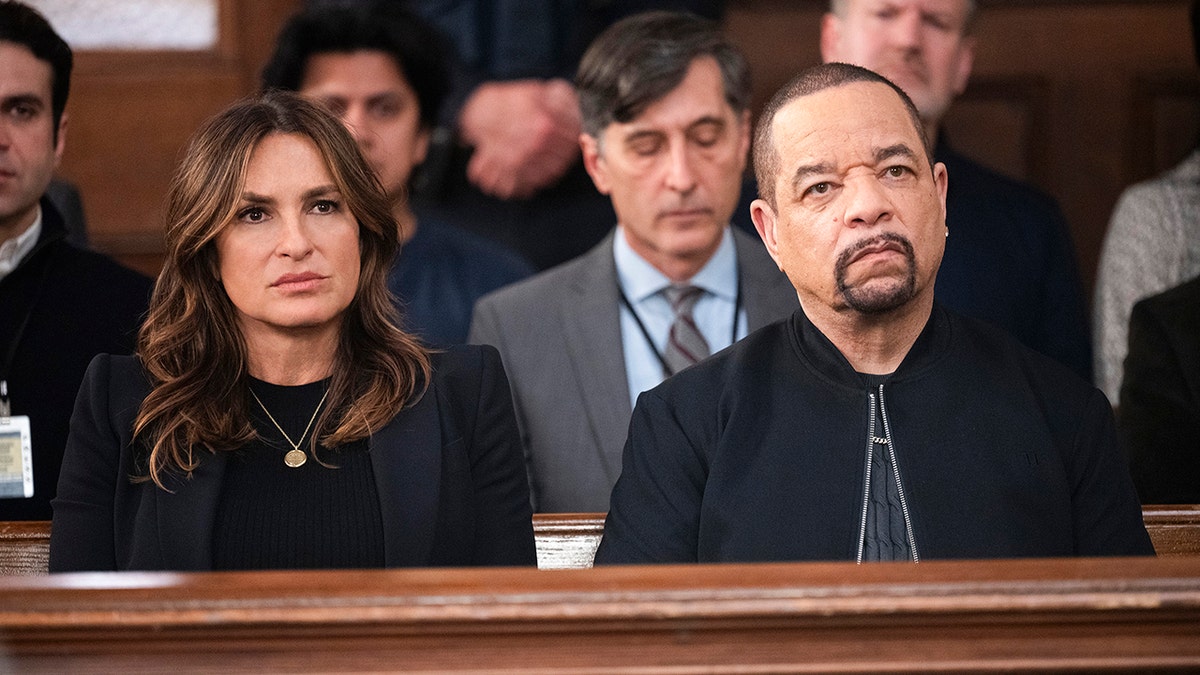 Mariska Hargitay and Ice-T in character on "Law & Order: SVU" sit in a courtroom in the first row