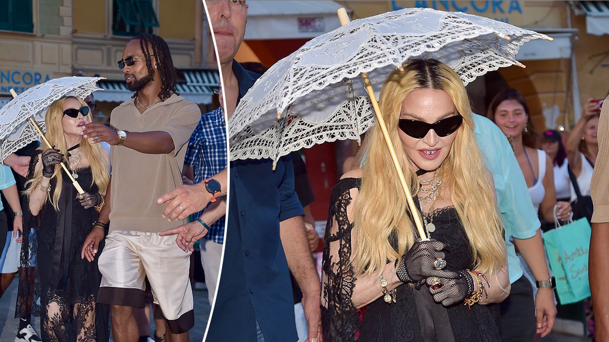 Madonna mira a su rumoreado novio Akeem Morris mientras pasea por Portofino, sosteniendo una sombrilla de encaje divide una foto de sólo Madonna paseando