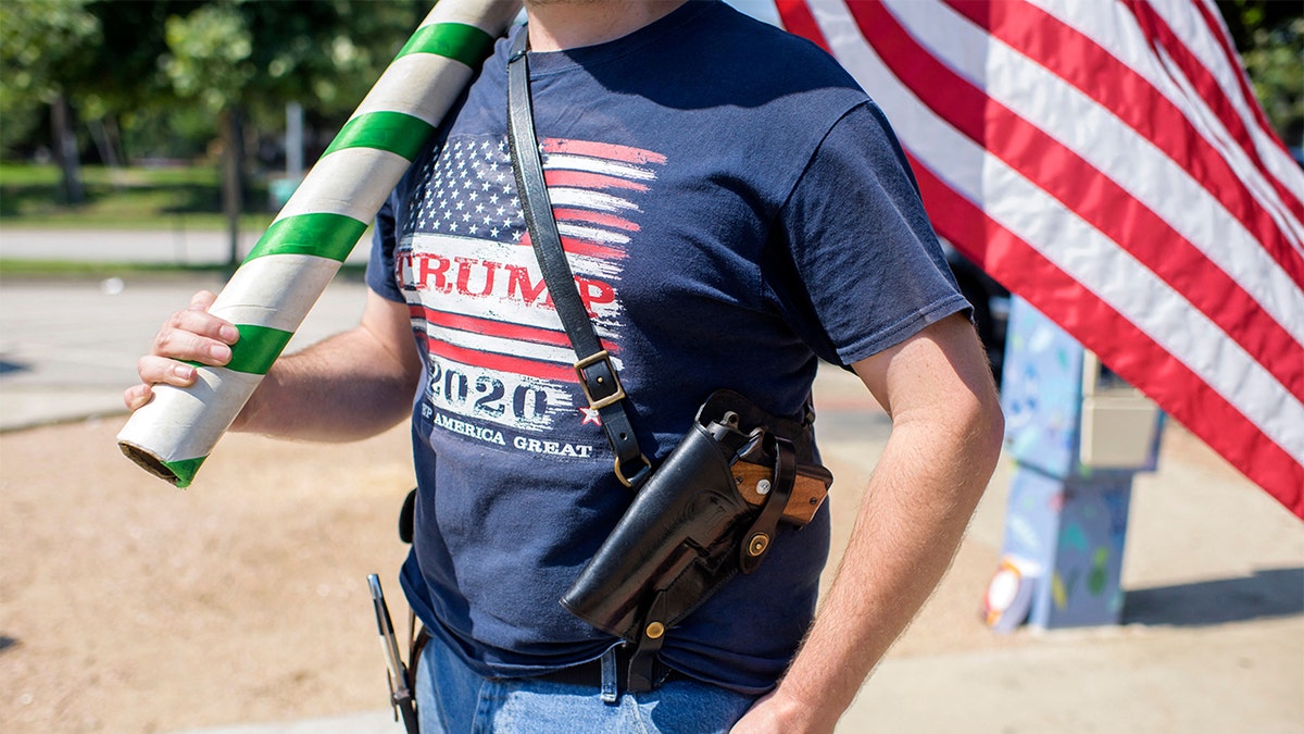 A man open carries a pistol in Texas.