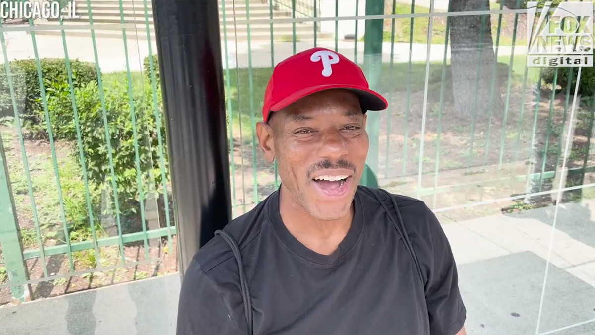 Chicago resident Johnny Williams in red Phillies cap