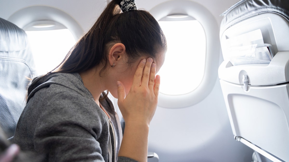 A nervous person on an airplane