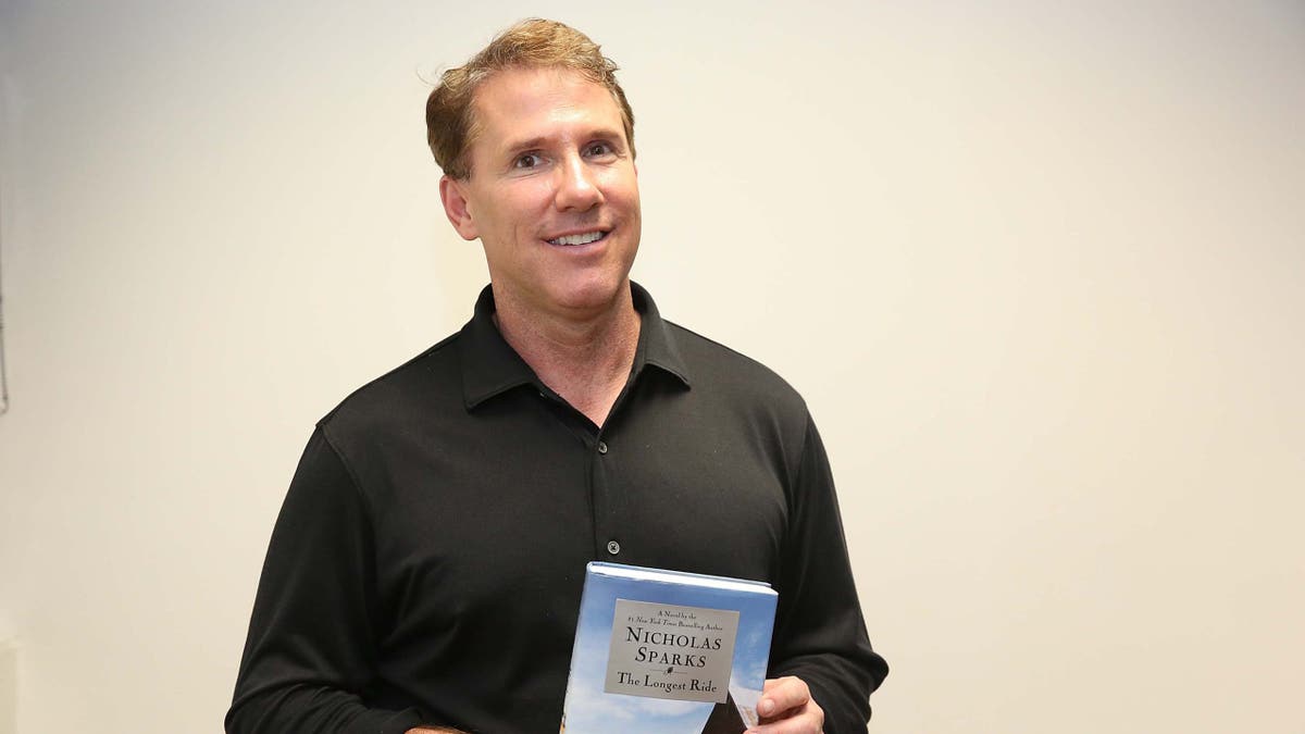 Nicholas Sparks holding "The Longest Ride" 