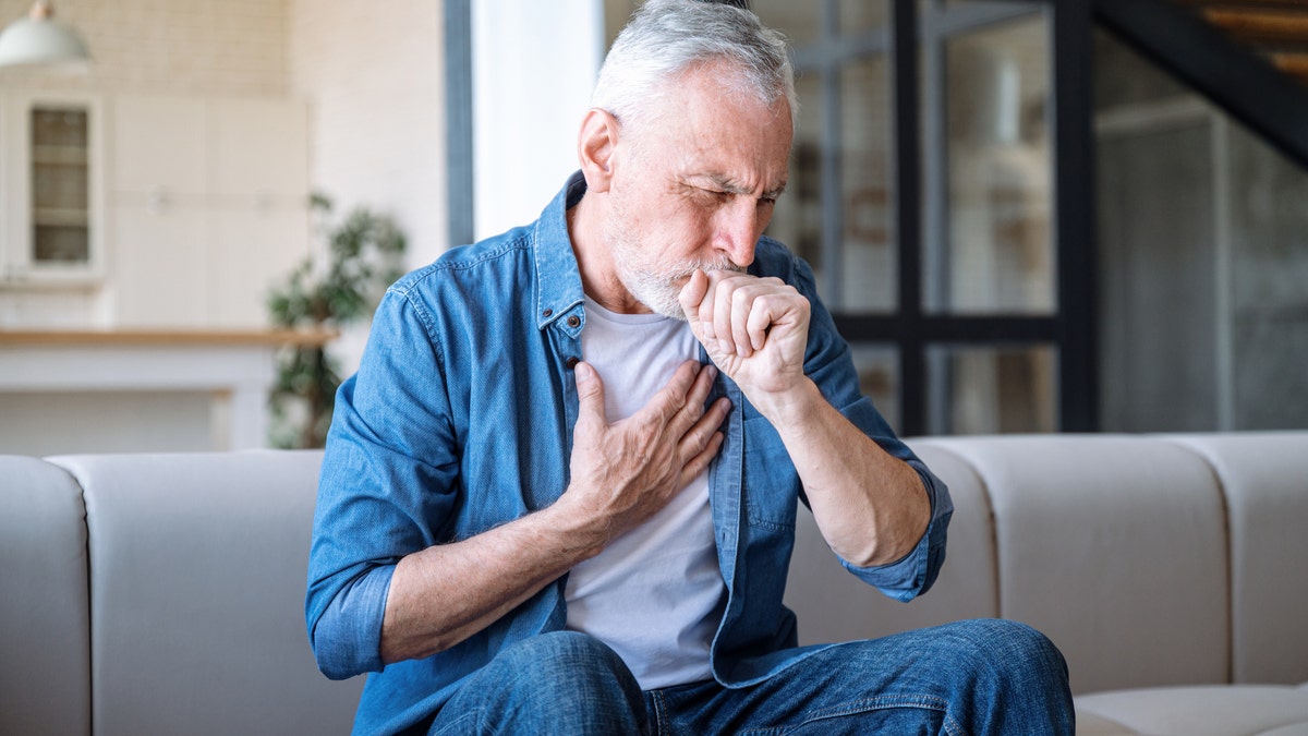 Older person coughing