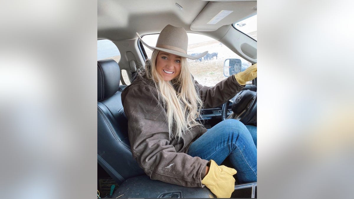 Paige Drummond drives a truck on the ranch