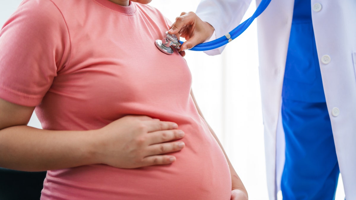 Pregnant woman at doctor