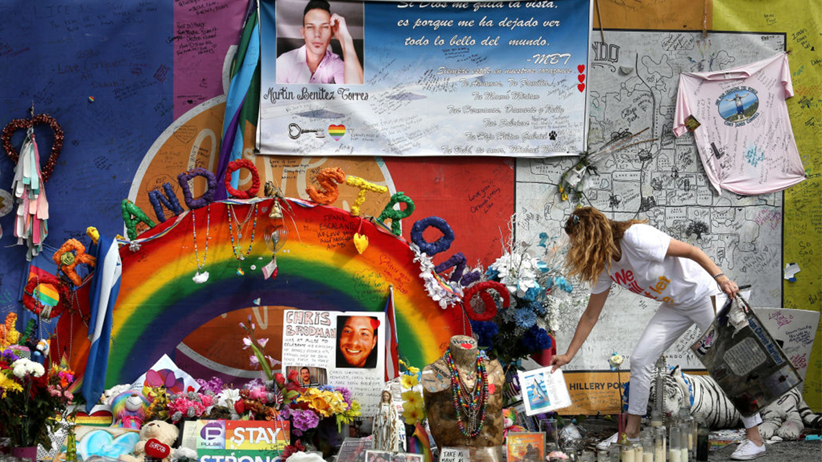 Pulse nightclub owner Barbara Poma tends to the memorial in front of her club