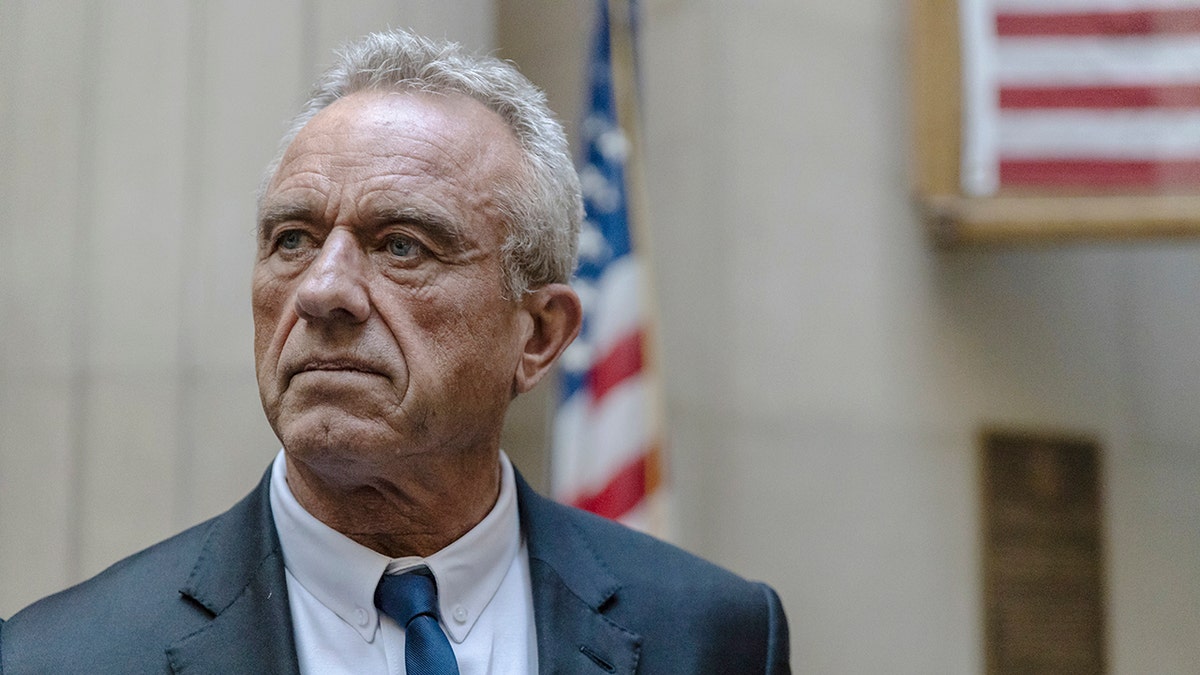 RFK Jr. in front of the US flag