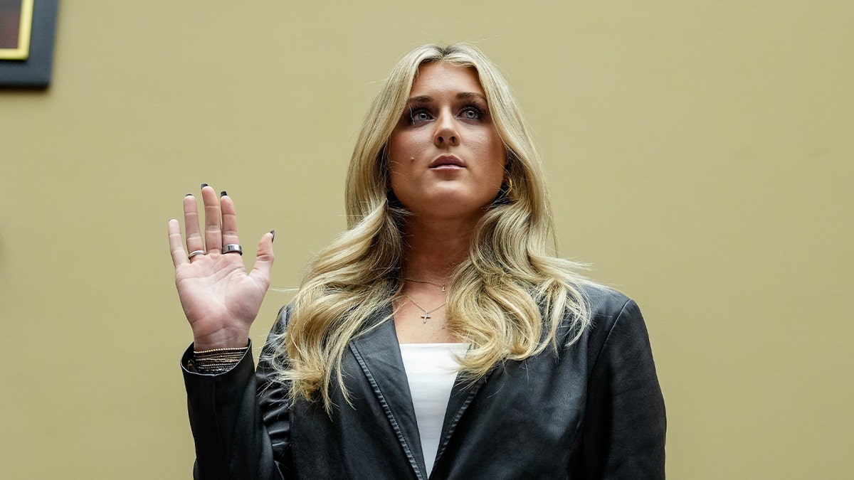 Riley Gaines is sworn in during a House Health Care and Financial Services Subcommittee hearing on Capitol Hill in Washington, DC, December 5, 2023.