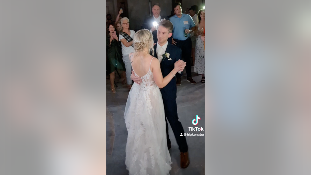 Newlyweds dancing at wedding