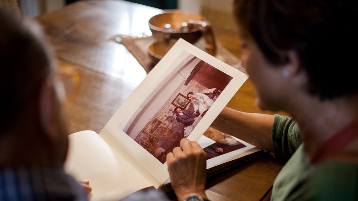 Senior looking at old photos