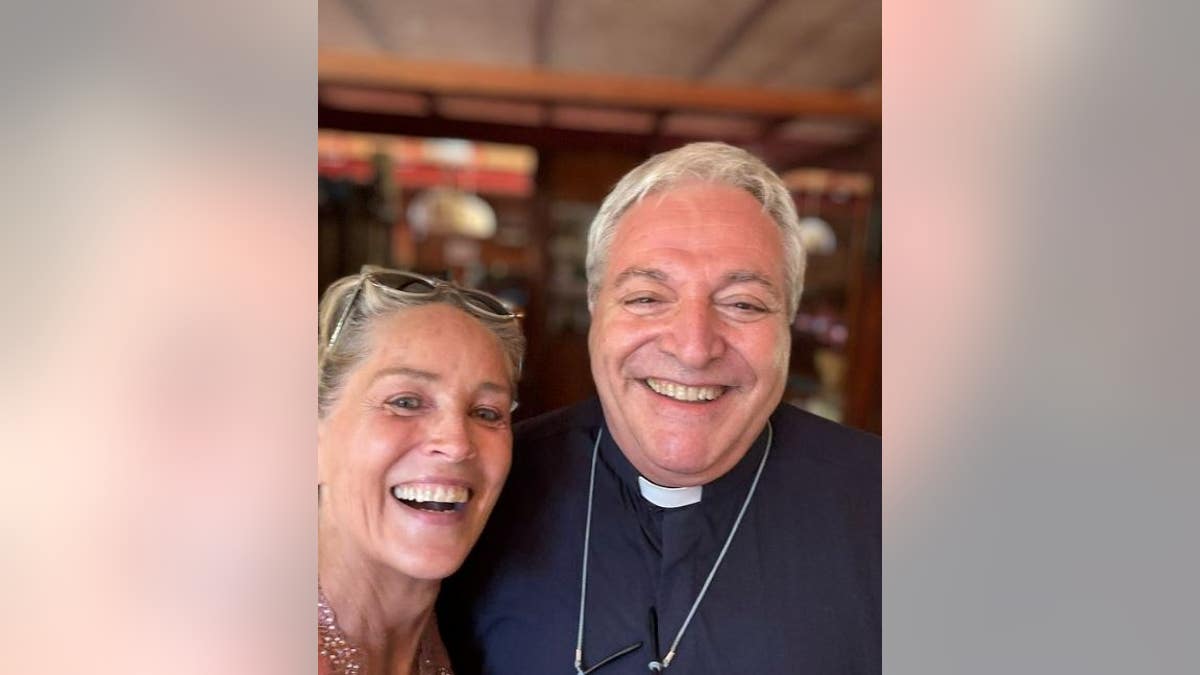 Sharon Stone with a priest at the Vatican