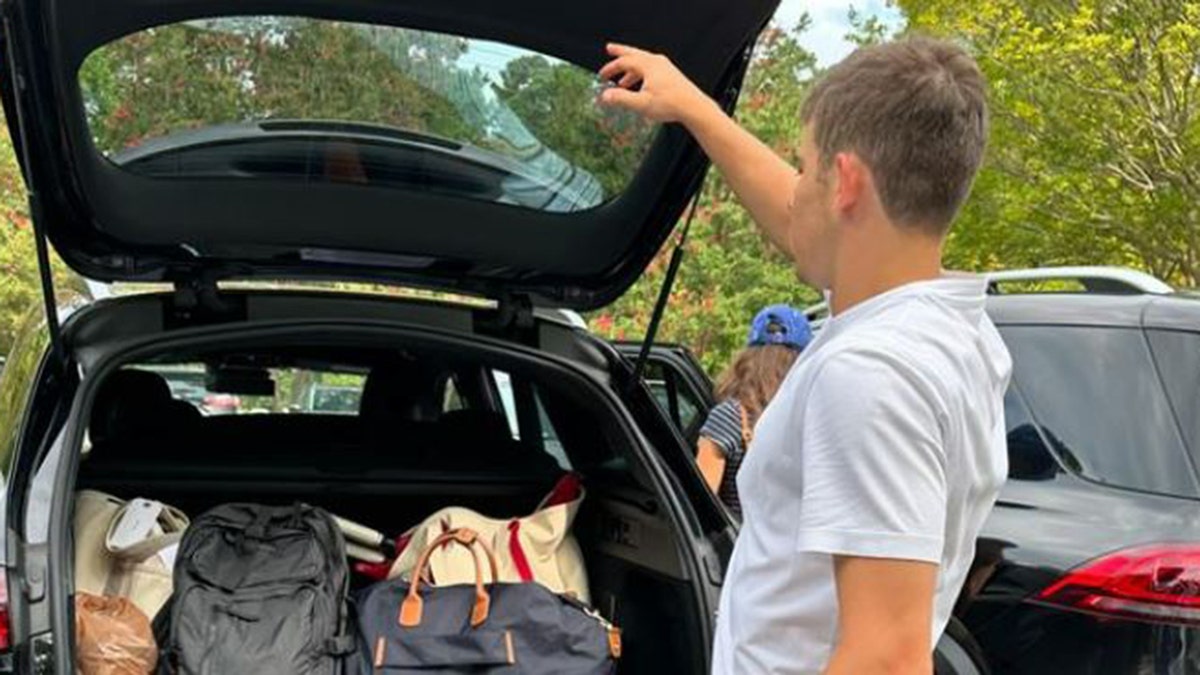 Shepherd Seinfeld uploading the car at college